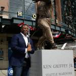 Mariners Hall of Famer Ken Griffey Jr. poses for a photo with a statue of him that was unveiled on April 13, 2017, in front of Safeco Field in Seattle. (AP Photo/Ted S. Warren)