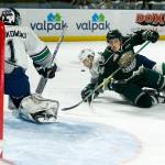 Silvertips right wing Riley Sutter (right) is brought down in front of Seattle&rsquo;s net during Game 3 of a second round playoff series at the ShoWare Center in Kent on April 11. (Ian Terry / The Herald)