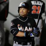 The Marlins&rsquo; Ichiro Suzuki holds his bat and looks to the scoreboard while walking in the dugout after grounding out in the eighth inning of a game against the Mariners on April 17, 2017, in Seattle. (AP Photo/Ted S. Warren)