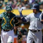 The Mariners&rsquo; Taylor Motter (right) celebrates in front of Oakland catcher Stephen Vogt (left) after hitting a grand slam in the third inning of a game April 23, 2017, in Oakland, Calif. (AP Photo/Ben Margot)