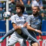 Galaxy midfielder Joao Pedro (left) and Sounders midfielder Clint Dempsey battle for the ball during the second half of a match April 23, 2017, in Carson, Calif. The Sounders won 3-0. (AP Photo/Mark J. Terrill)