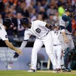 The Tigers&rsquo; Justin Upton (center) is congratulated by Tyler Collins after they scored on Upton&rsquo;s two-run home run in the fourth inning of a game against the Mariners on April 25, 2017, in Detroit. (AP Photo/Carlos Osorio)