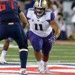 Washington defensive lineman Elijah Qualls (11) during the first half of a game against Arizona on Sept. 24, 2016, in Tucson, Ariz. (AP Photo/Rick Scuteri)