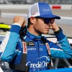 Kyle Larson prepares to get in his car prior to qualifying for the NASCAR Cup Series race at Richmond International Raceway on April 28, 2017, in Richmond, Va. (AP Photo/Steve Helber)