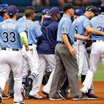 Tampa Bay Rays first base coach Rocco Baldelli, second from right, holds back Steven Souza Jr. as members of the Tampa Bay Rays and Toronto Blue Jays clear the benches following Souza Jr.&rsquo;s slide into second base during the second inning of a baseball game, Sunday, April 9, 2017, in St. Petersburg, Fla. (AP Photo/Mike Carlson)