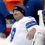 In this Jan. 1, 2017, photo, Dallas Cowboys quarterback Tony Romo smiles on the bench during the second half of an NFL game against the Eagles in Philadelphia. A person with knowledge of the decision said Romo is retiring. (AP Photo/Matt Rourke, File)