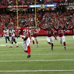 Falcons cornerback Desmond Trufant celebrates picking off Buccaneers quarterback Jameis Winston during the first halfof a game on Sunday, Sept. 11, 2016, in Atlanta. (AP Photo/John Bazemore)