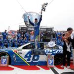 Jimmie Johnson (center) celebrates after winning a NASCAR Monster Cup Series auto race on Monday in Bristol, Tennessee. (AP Photo/Wade Payne)