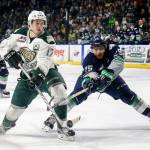 The Silvertips&rsquo; Matt Fonteyne attempts a shot in the second period with the Thunderbirds&rsquo; Ethan Bear trailing during Game 2 of their playoff series on April 8, 2017, at Xfinity Arena in Everett. (Kevin Clark / The Herald)