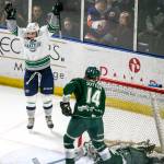 Seattle&rsquo;s Donovan Neuls (left) celebrates the first goal the game with Everett&rsquo;s Riley Sutter (14) and Carter Hart looking on during Game 4 of a second-round playoff series on April 14, 2017, at Showare Center in Kent. (Kevin Clark / The Herald)