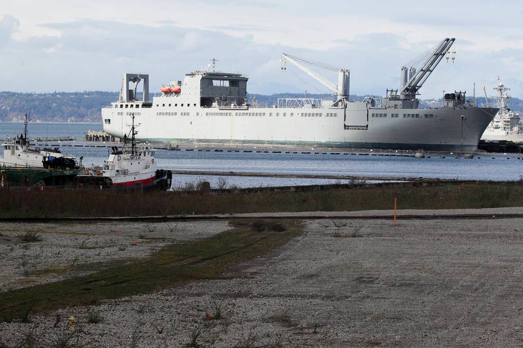 Navy vessels are seen along with part of the empty lot which used to be home to the Everett Kimberly-Clark mill. (Ian Terry / The Herald)