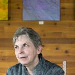 Wyonne Perrault, director of North Counties Family Services, talks about the effects of a mudslide that closed Highway 530 this week. The highway was reopened Wednesday, but residents worry that geologically related closures could become common. (Andy Bronson / The Herald)