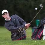 Snohomish&rsquo;s Nolan Armbruster hits out of a bunker Monday during the Dolan Invitational at Everett Golf & Country Club. (Andy Bronson / The Herald)