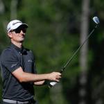 Justin Rose, of England, hits a shot on the 12th hole during the final round of the Masters golf tournament Sunday, April 9, in Augusta, Ga. (AP Photo/David Goldman)
