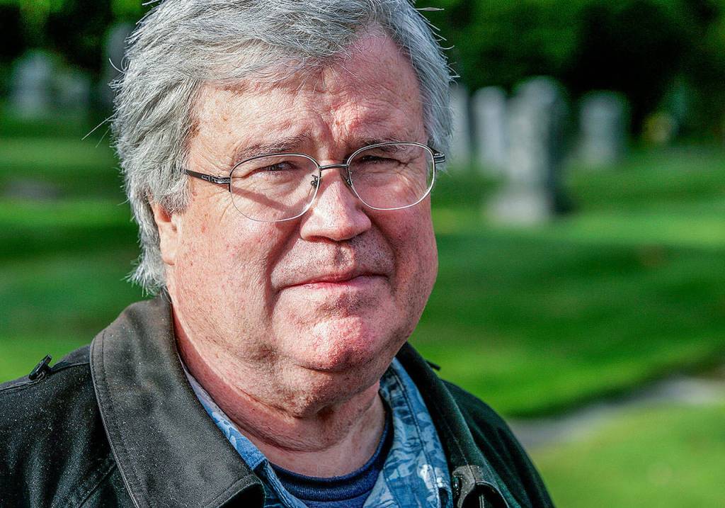 David Dilgard, a historian with the Everett Public Library, speaks to members of the Everett Mayor&rsquo;s Youth Council during his guided tour of the Evergreen Cemetery in October 2010. (Herald file)