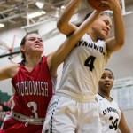 Lynnwood&rsquo;s Nakia Boston fights for a rebound with Katie Brandvold of Snohomish during the championship game of the Northwest 3A District girls basketball tournament in February. Lynnwood beat Snohomish 55-53, but received a lower seed in the state tournament based on the RPI rankings. (Daniella Beccaria / The Herald)