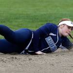 Meadowdale&rsquo;s Olivia Dimmock dives for a grounder during a game against Snohomish on April 25 in Snohomish. (Andy Bronson / The Herald)