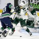 The Thunderbirds&rsquo; Zack Andrusiak (left) attempts a shot in the first period with the Silvertips&rsquo; Devon Skoleski (center) and Carter Hart defending during Game 2 of their playoff series on April 8, 2017, at Xfinity Arena in Everett. (Kevin Clark / The Herald)