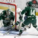 Seattle&rsquo;s Sami Moilanen (center) works a shot attempt past Everett&rsquo;s Carter Hart (left) and Riley Sutter during Game 4 of a second-round playoff series on April 14, 2017, at Showare Center in Kent. (Kevin Clark / The Herald)