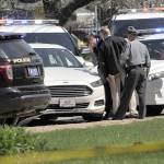 Pennsylvania State Police look over a car as they investigate the scene where Steve Stephens, the suspect in the random killing of a Cleveland retiree posted on Facebook, was found shot dead Tuesday, April 18, in Erie. Pennsylvania. (Greg Wohlford/Erie Times-News via AP)