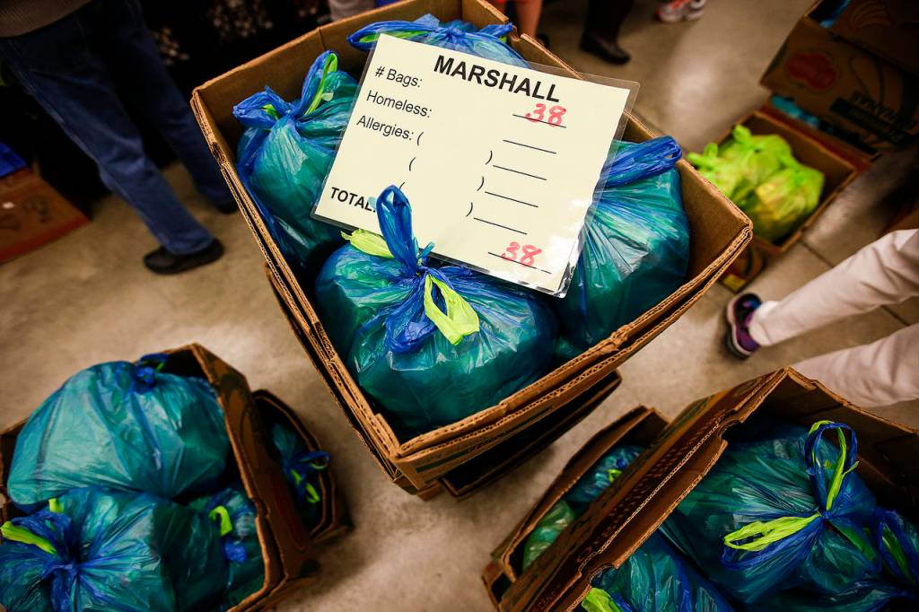 Bags of food at the Marysville Community Food Bank await delivery to schools. (Ian Terry / The Herald)