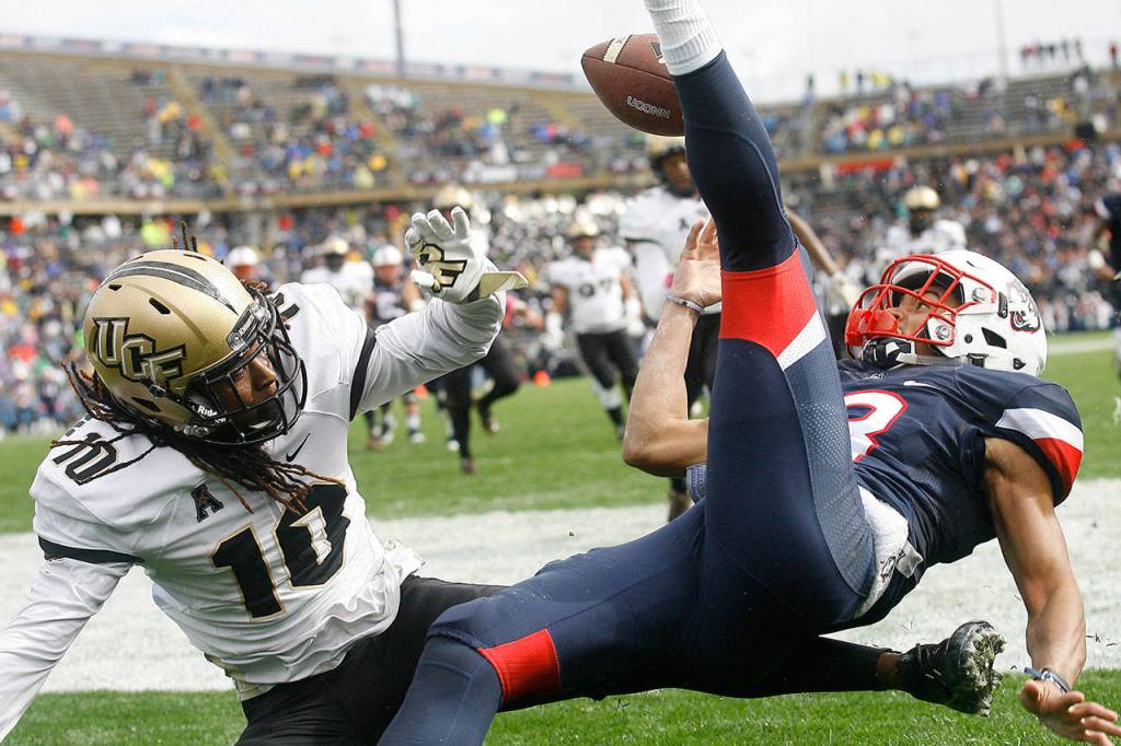 Central Florida defensive back Shaquill Griffin (10) breaks up a pass in the end zone intended for Connecticut wide receiver Brian Lemelle (18) during the first quarter of a game Oct. 22, 2016, in East Hartford, Conn. (AP Photo/Stew Milne)