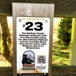 Small sign posts along the trail mark where the Northern Pacific Railroad once ran along the South Bay Trail between Fairhaven and Bellingham. (Aaron Swaney photo)