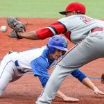 Edmonds Community College&rsquo;s Jake Malone is tagged out at first by Everett Community College&rsquo;s Peyton Cordova-Smith during game April 29, 2017, in Edmonds. (Kevin Clark / The Herald)