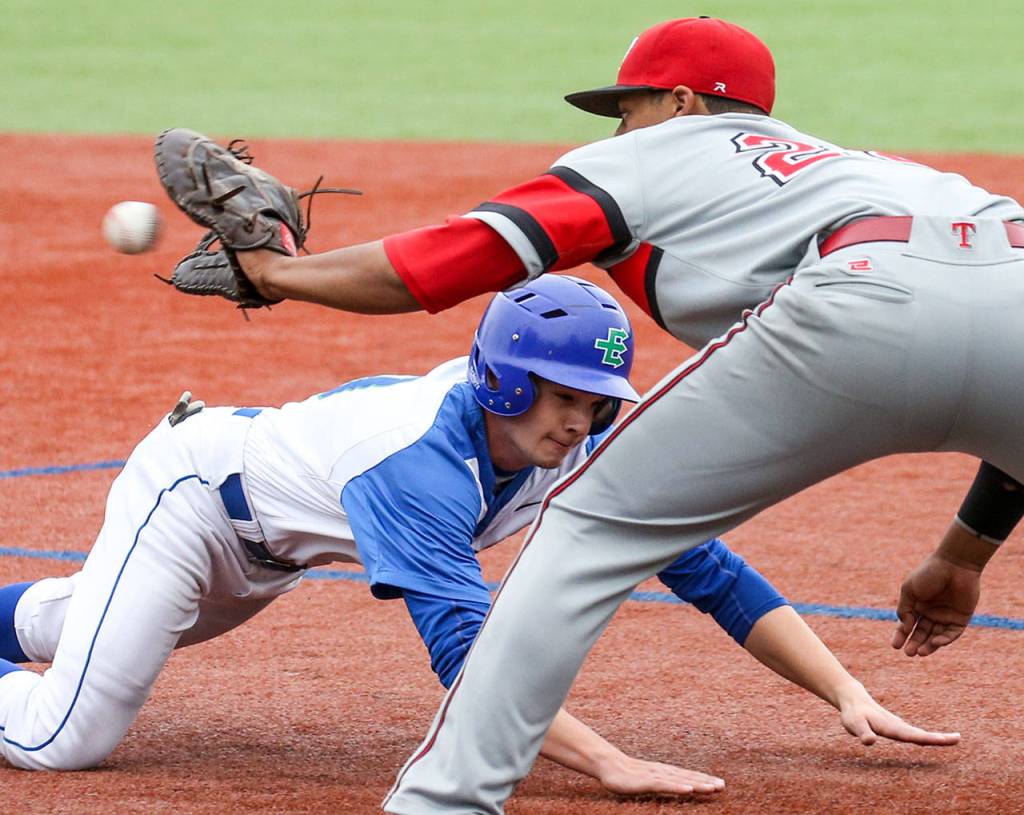 Edmonds Community College&rsquo;s Jake Malone is tagged out at first by Everett Community College&rsquo;s Peyton Cordova-Smith during game April 29, 2017, in Edmonds. (Kevin Clark / The Herald)