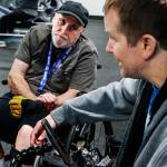 Scott Ballenger stops to talk with Duitsman and observe some of his workout. (Dan Bates / The Herald)