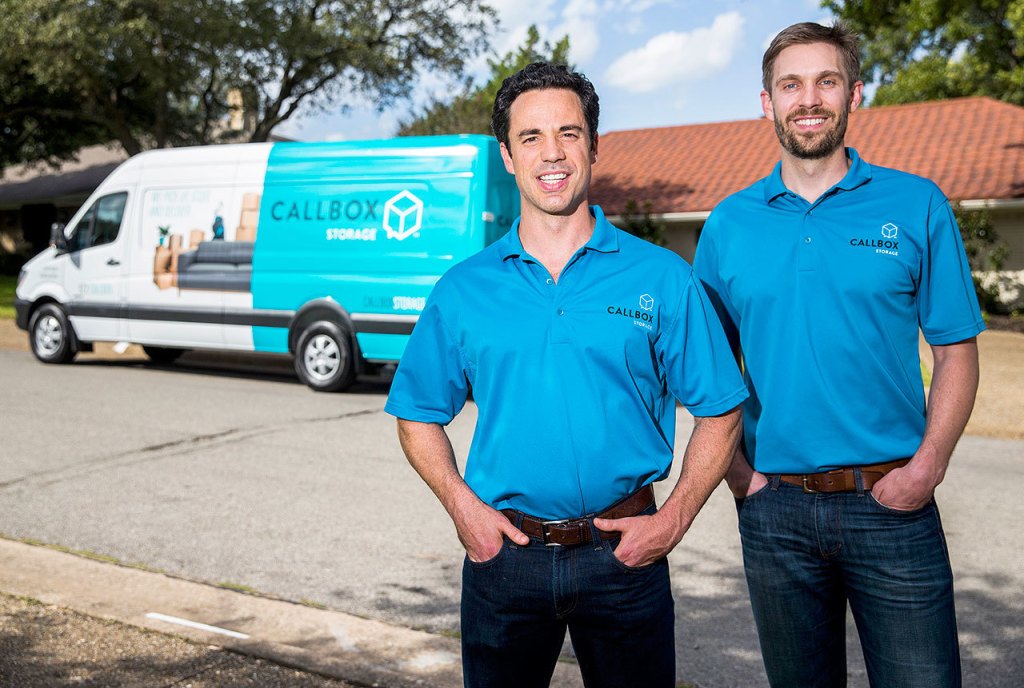 Callbox Storage co-founders Dan Slaven (left) and Kyle Bainter pose for a photo with their moving truck onOct. 4 at a client&rsquo;s home in Dallas. (Ashley Landis/The Dallas Morning News/TNS)