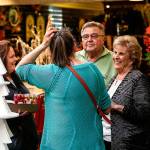 Longtime customers and friends, Victoria Friar (left), and Nancy Sewell, both of Edmonds, get a chance to talk with Jim and Dorothy Anderson Friday morning as the store filled with shoppers taking advantage of the price cuts on the unique inventory. (Dan Bates / The Herald)