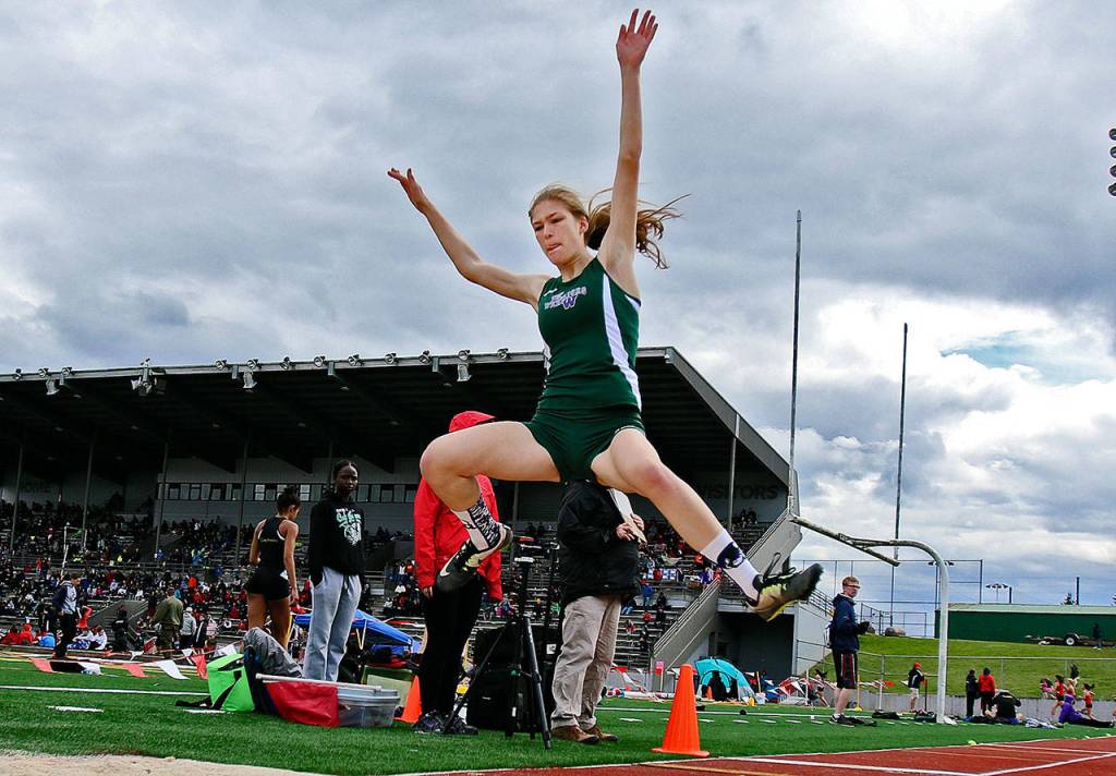 Edmonds-Woodway&rsquo;s Hannah Hicks makes a leap in the long jump during the Eason Invitational on April 22, 2017, at Veteran&rsquo;s Memorial Stadium in Snohomish. (Kevin Clark / The Herald)