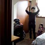 Ernesto Martinez-Hernandez, left, and his little sister Maritza dance along with a video game at their home in Monroe.                                (Kevin Clark / The Herald)