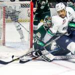 Seattle&rsquo;s Keegan Kolesar (right) works the puck after a shot attempt with Everett&rsquo;s Carter Hart defending during Game 4 of a second-round playoff series on April 14, 2017, at Showare Center in Kent. (Kevin Clark / The Herald)