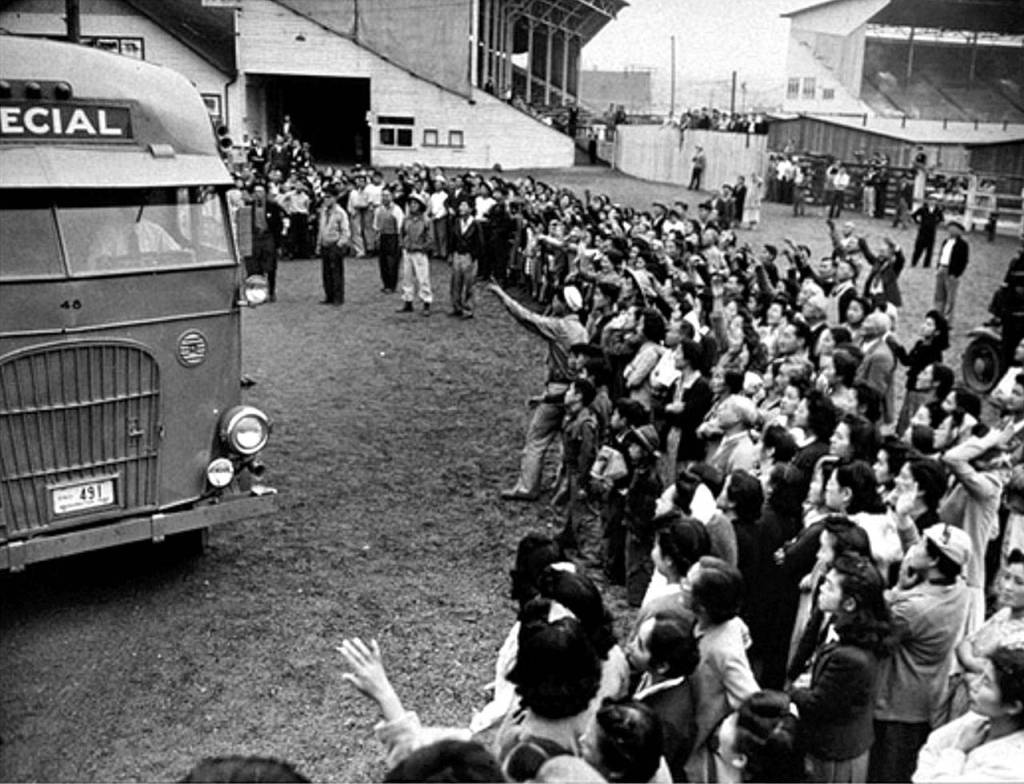 Japanese-Americans arrive at &ldquo;Camp Harmony,&rdquo; a facility in Puyallup used in the internment process during World War II. Cascade High School recently hosted Atsushi Kiuchi, 87, who spent time at the facility officially known as the Puyallup Assembly Center. (National Archives photos)