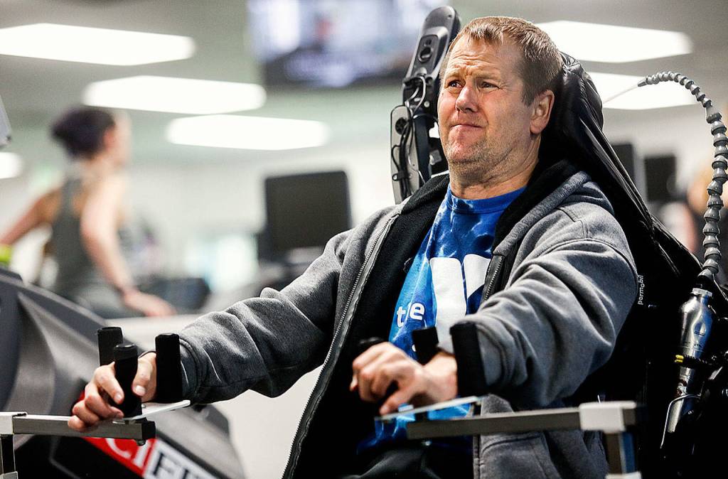 Todd Duitsman works out on special equipment. (Dan Bates / The Herald)