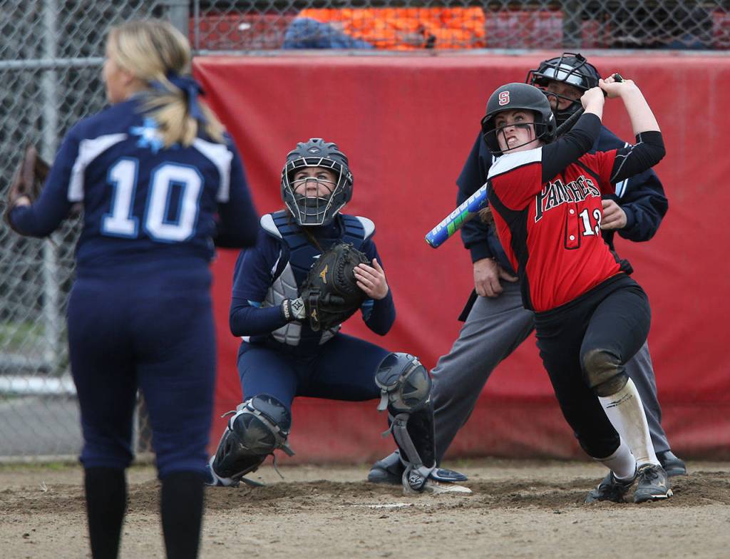 All eyes are on the ball as Snohomish&rsquo;s Ame Bridgeman hits an RBI double during a game against Meadowdale on April 25 in Snohomish. (Andy Bronson / The Herald)