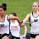 Glacier Peak&rsquo;s Lena Agnew (right) hands off to teammate Tamia DeSchmidt in the 4x100-meter relay during the Eason Invitational on April 22, 2017, at Veteran&rsquo;s Memorial Stadium in Snohomish. (Kevin Clark / The Herald)