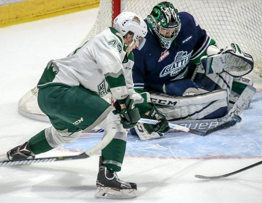The Silvertips&rsquo; Connor Dewar scores a goal in the first period past Thunderbirds goalie Carl Stankowski during Game 2 of their playoff series on April 8, 2017, at Xfinity Arena in Everett. (Kevin Clark / The Herald)