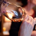 A wine-taster checks the aroma of the wine available at Dusty Cellars Winery on Camano Island on Feb. 4. (Kevin Clark / The Herald)