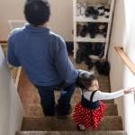 Eutiquio Martinez-Garcia and Maritza Martinez-Hernandez make their way downstairs in their new home.                                (Kevin Clark / The Herald)