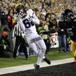 Michigan wide receiver Amara Darboh (left) tries to make a reception in the end zone in front of Iowa defensive back Manny Rugamba during the first half of a game Nov. 12, 2016, in Iowa City, Iowa. (AP Photo/Charlie Neibergall)