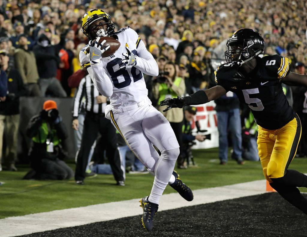 Michigan wide receiver Amara Darboh (left) tries to make a reception in the end zone in front of Iowa defensive back Manny Rugamba during the first half of a game Nov. 12, 2016, in Iowa City, Iowa. (AP Photo/Charlie Neibergall)