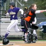 Lake Stevens&rsquo; Camryn Dubois scores a run as Monroe&rsquo;s Taylor Durant points to second base in Lake Stevens&rsquo; win over Monroe, 2-0, in a fastpitch game April 17 in Lake Stevens. (Andy Bronson / The Herald)