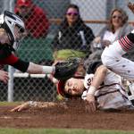Snohomish&rsquo;s Josh Johnson beats the tag by Marysville Pilchuck catcher Jordan Luton as Snohomish wins, 4-3, in extra innings of baseball April 18 in Snohomish. (Andy Bronson / The Herald)