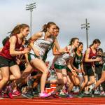 Runners from Cascade, Mount Vernon and Jackson high schools start the 3200M race at Everett Memorial Stadium on April 13. (Kevin Clark / The Herald)
