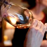 A wine taster checks the aroma of the wine available at Dusty Cellars on Camano Island on Feb. 4. (Kevin Clark / The Herald)