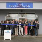 Edmonds Mayor Dave Earling helps with the ribbon cutting of the new Taj Mahal Handicraft Marble. (Contributed photo)