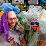 As part of Earth Week, Dan Bauer (left) and William Frankhouser, aka &ldquo;Bagfoot(s),&rdquo; each wear 550 plastic bags, the average number a single human tosses out each year, during Everett Community College&rsquo;s annual plant swap at Whitehorse Hall on Tuesday. When the baggy duo are working, they are part of the college&rsquo;s IT team. (Dan Bates / The Herald)